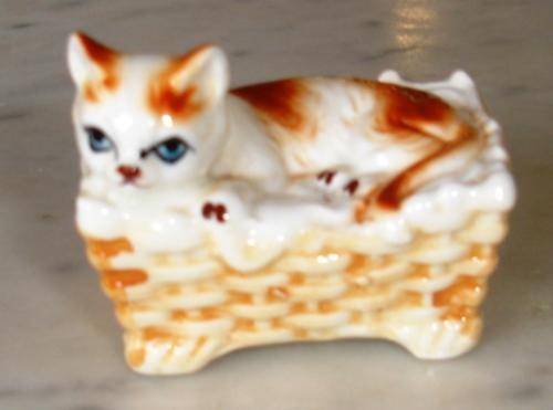 Cat on basket ornament
