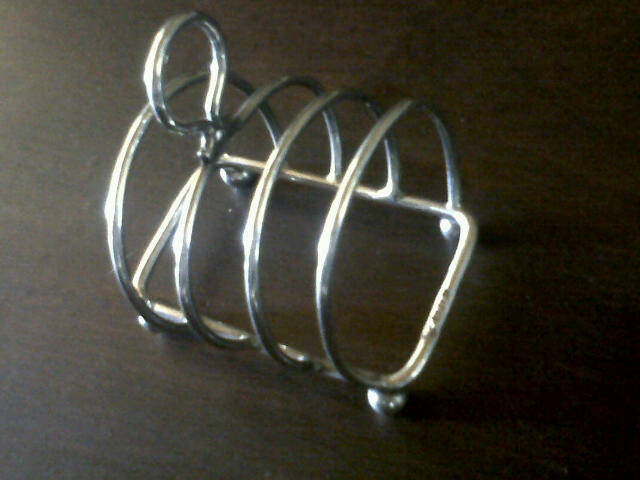 ANTIQUE SOLID STERLING TOAST HOLDER