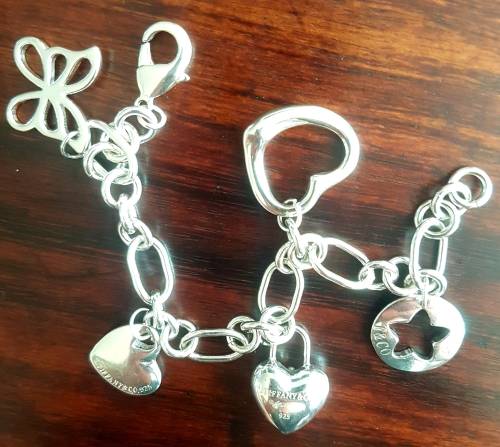 Heavy and chunky sterling silver charm bracelet from Tiffany and co... weight 35 grams sterling
