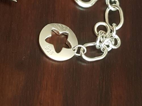 Heavy and chunky sterling silver charm bracelet from Tiffany and co... weight 35 grams sterling