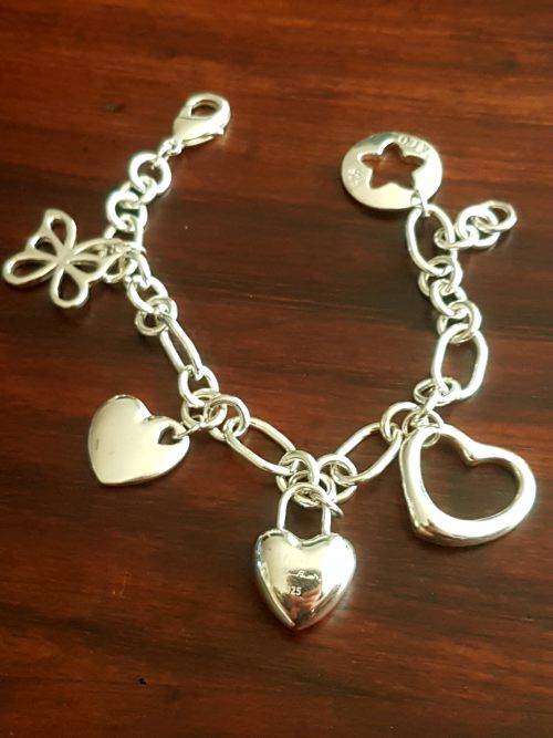 Heavy and chunky sterling silver charm bracelet from Tiffany and co... weight 35 grams sterling