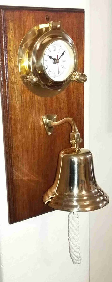Solid brass bell and nautical clock. Bell 15cm diameter clock 15cm