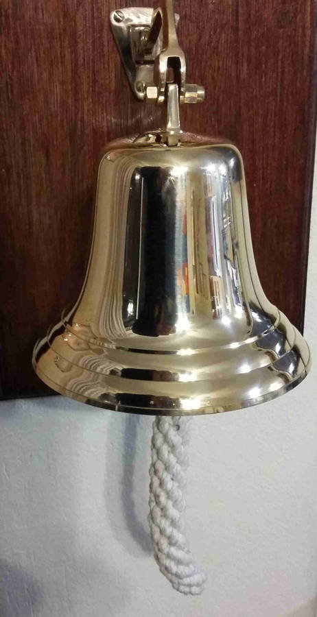 Solid brass bell and nautical clock. Bell 15cm diameter clock 15cm