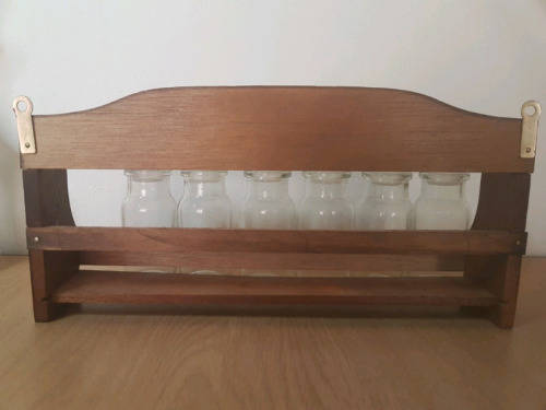 Spice rack with glass bottles