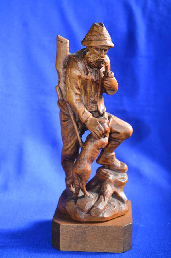 Wooden Carving of a Hunter with his Dog