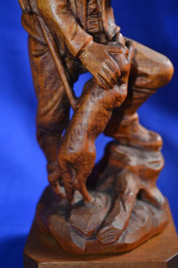 Wooden Carving of a Hunter with his Dog
