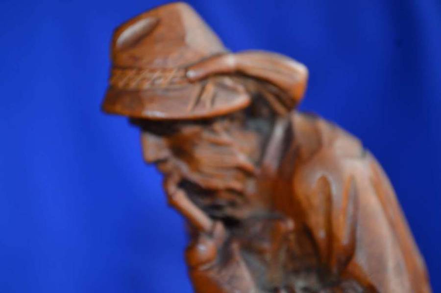 Wooden Carving of a Hunter with his Dog