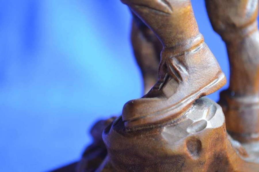 Wooden Carving of a Hunter with his Dog