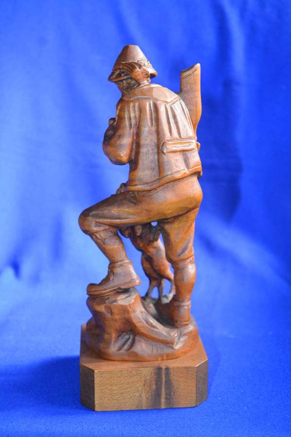 Wooden Carving of a Hunter with his Dog
