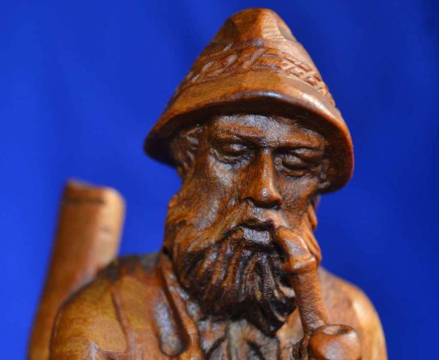 Wooden Carving of a Hunter with his Dog
