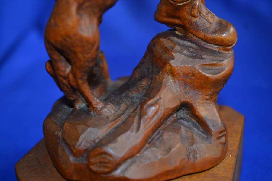 Wooden Carving of a Hunter with his Dog