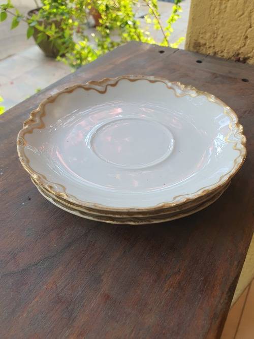 Vintage or antique Haviland Limoge France saucer, white scalloped with gilt pattern on border