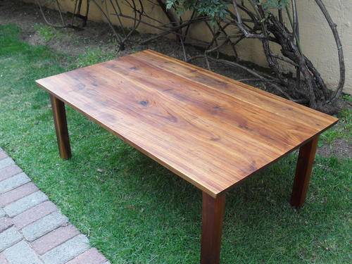 VERY HEAVY COFFEE TABLE MADE OF WHAT I BELIEVE IS SOLID KIAT WOOD. IT IS MAGNIFICENT!