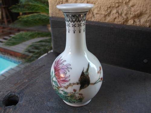 SMALL ORIENTAL BUD VASE WITH BIRD AND FLOWER DETAIL. MARKED