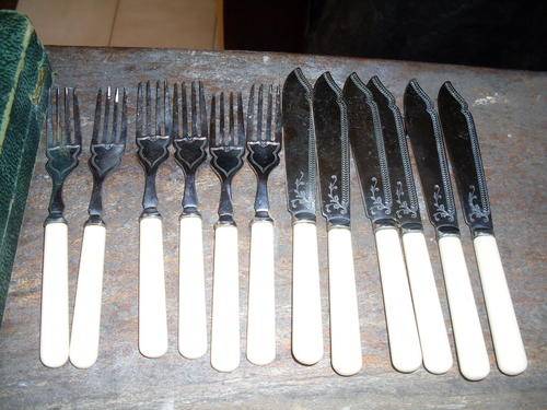 LOVELY SILVER CHROME PLATED SET OF SIX FISH KNIVES AND FORKS IVORINE HANDLES . LOVELY PATTERN