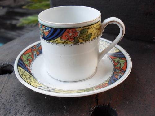 DEMI TASSE B G BAVARIA CUP AND SAUCER. YELLOW/BLUE ORANGE COLOURS IN FLORAL & LEAF ATTERN
