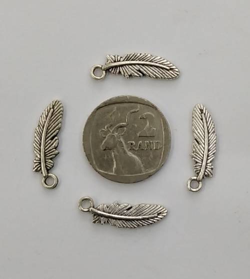 10 x Silver Feather Charms, detail on both sides. 23mm x 7mm, hole 2mm.