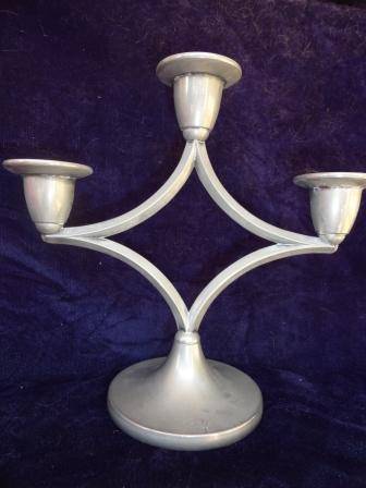 A delightful three piece candlestand
