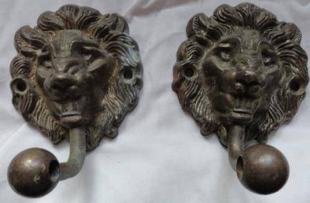 Vintage -a pair of solid brass lion motif hangers