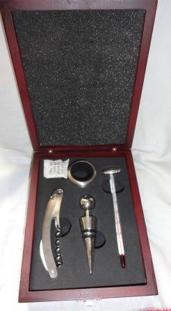 An unused boxed (wooden) bar set containing four items