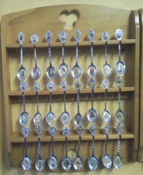24 Highly Collectable Spoons + Yellow Wood Display