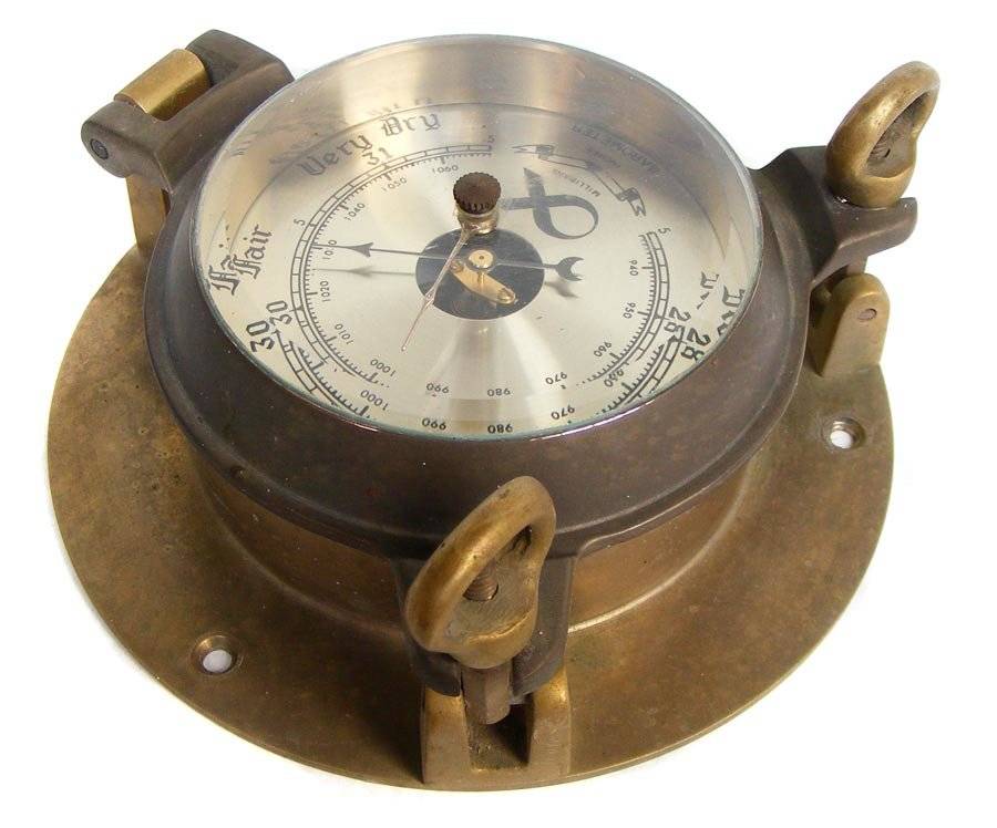 Vintage barometer in solid brass porthole style casing