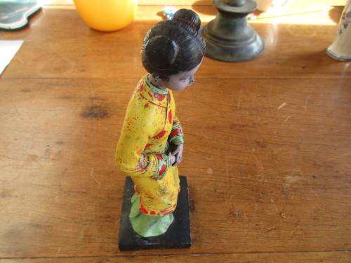 LOVELY ORIENTAL YOUNG LADY IN YELLOW OUTFIT