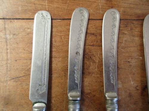 6 Red resin handled butter knives
