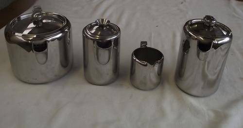 FOUR ASSORTED STAINLESS STEEL TEAPOTS AND MILK JUG