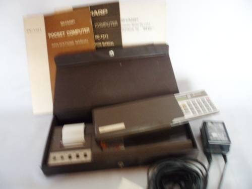 Sharp PC-1211 Programmable Pocket Computer with CE-121 Printer, charger and all Manuals