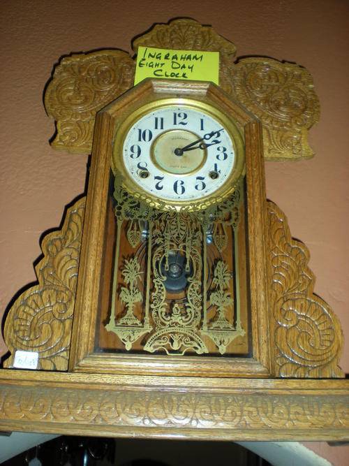 A BEAUTIFUL CARVED INGRAHAM EIGHT DAY CLOCK
