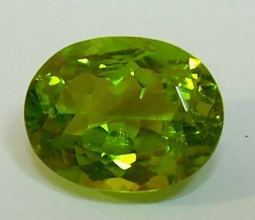 Certified Apple Green Peridot - I1, 3.48 ct. - Oval Faceted
