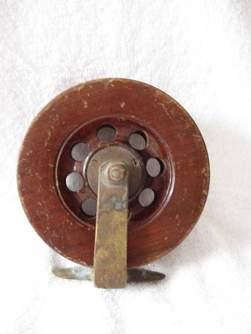 wood and brass reel