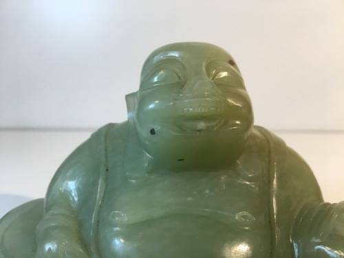 A CHINESE ORIENTAL GREEN STONE CARVED BUDDHA
