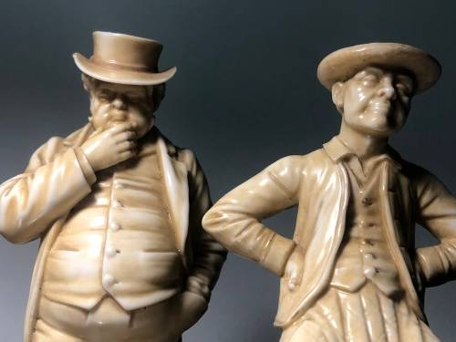 A PAIR OF ROYAL WORCESTER HADLEY COUNTRIES OF THE WORLD FIGURINES