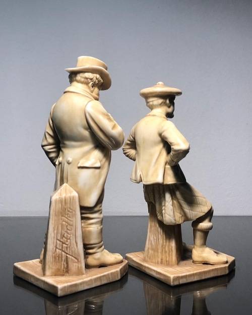 A PAIR OF ROYAL WORCESTER HADLEY COUNTRIES OF THE WORLD FIGURINES