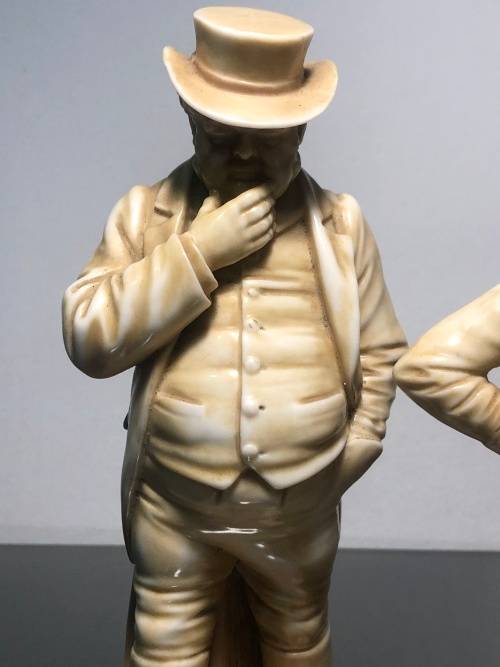 A PAIR OF ROYAL WORCESTER HADLEY COUNTRIES OF THE WORLD FIGURINES