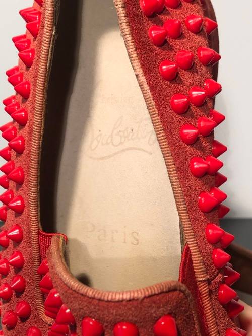 A Pair of Second Hand Christian Louboutin Red Spike Boat Shoes size 8.5