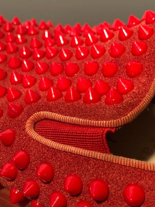 A Pair of Second Hand Christian Louboutin Red Spike Boat Shoes size 8.5