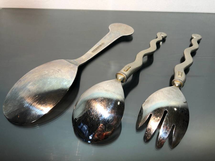 A set of Carol Boyes Wave Salad Spoons and a Larger Serving Spoon