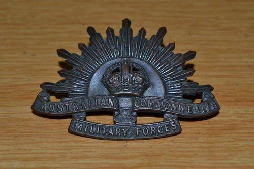 Australia Rising sun cap badge by Stokes and Son Melbourne.