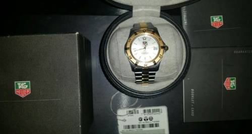 15 year old TAG HEUER watch gold and silver still has plastic on clip never been worn!!!!!!