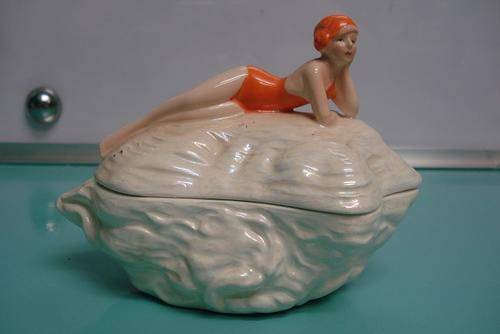 70's novelty shell trinket dish with flapper Art Deco burlesque figurine motif on top lid Hairline