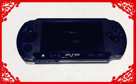BRAND NEW SONY PSP E1004 WITH 12 ORIGINAL GAMES AND 4 MOVINGS AND CHARGER