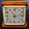 ESTYMA VINTAGE WIND UP TRAVEL ALARM CLOCK IN LEATHER CASE MADE IN GERMANY - WORKING CONDITION
