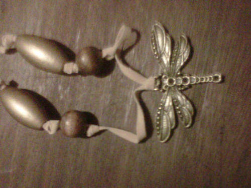 Bronze alloy dragonfly on leather with wooden beads