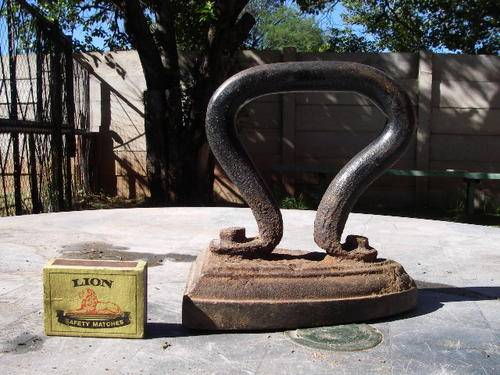 Antique wood or coal iron used on a stove modified handle once off.