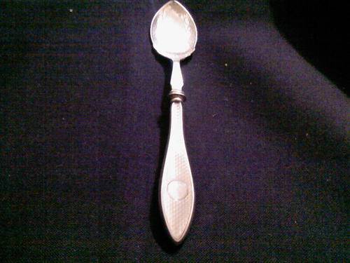 A HALLMARKED SILVER HANDLED SPOON STARTING AT R1