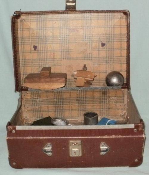 AN OLD SUITE CASE FULL OF ODDS AND ENDS