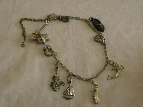 SILVER CHARM BRACELET WITH 11 CHARMS